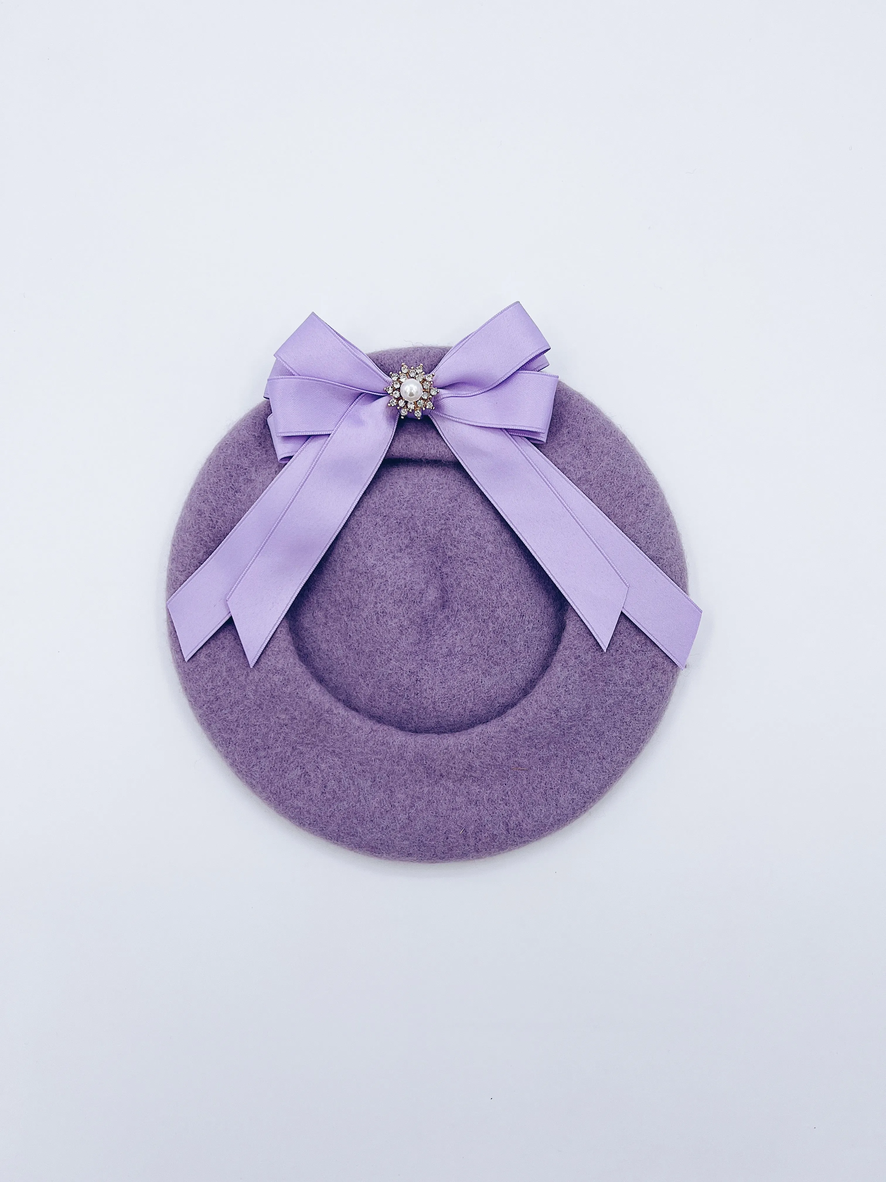 Classic Kids wool beret with beautiful bow details.
