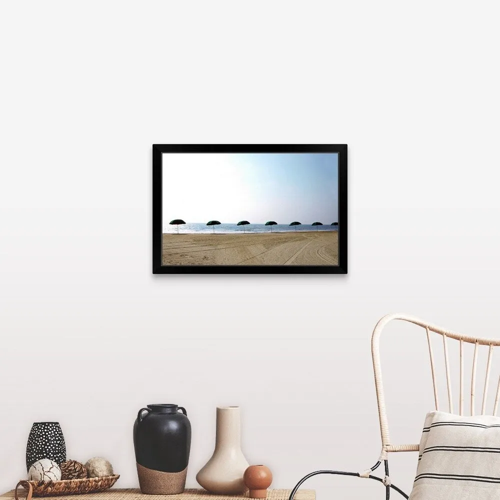 "Lineup of beach umbrellas, Amelia Island, FL" Black Framed Print